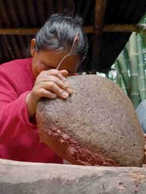 Stone-grinding by hand